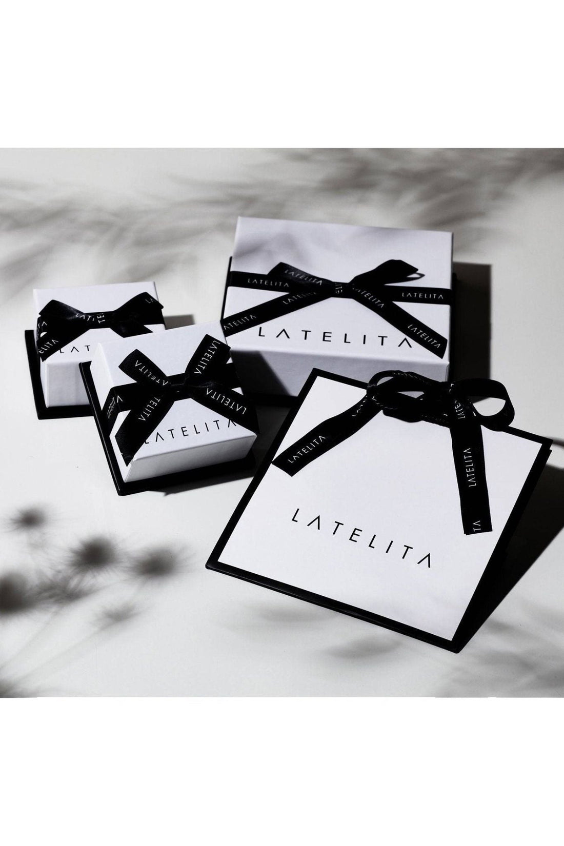 Jewelry gift bags with black ribbon bows