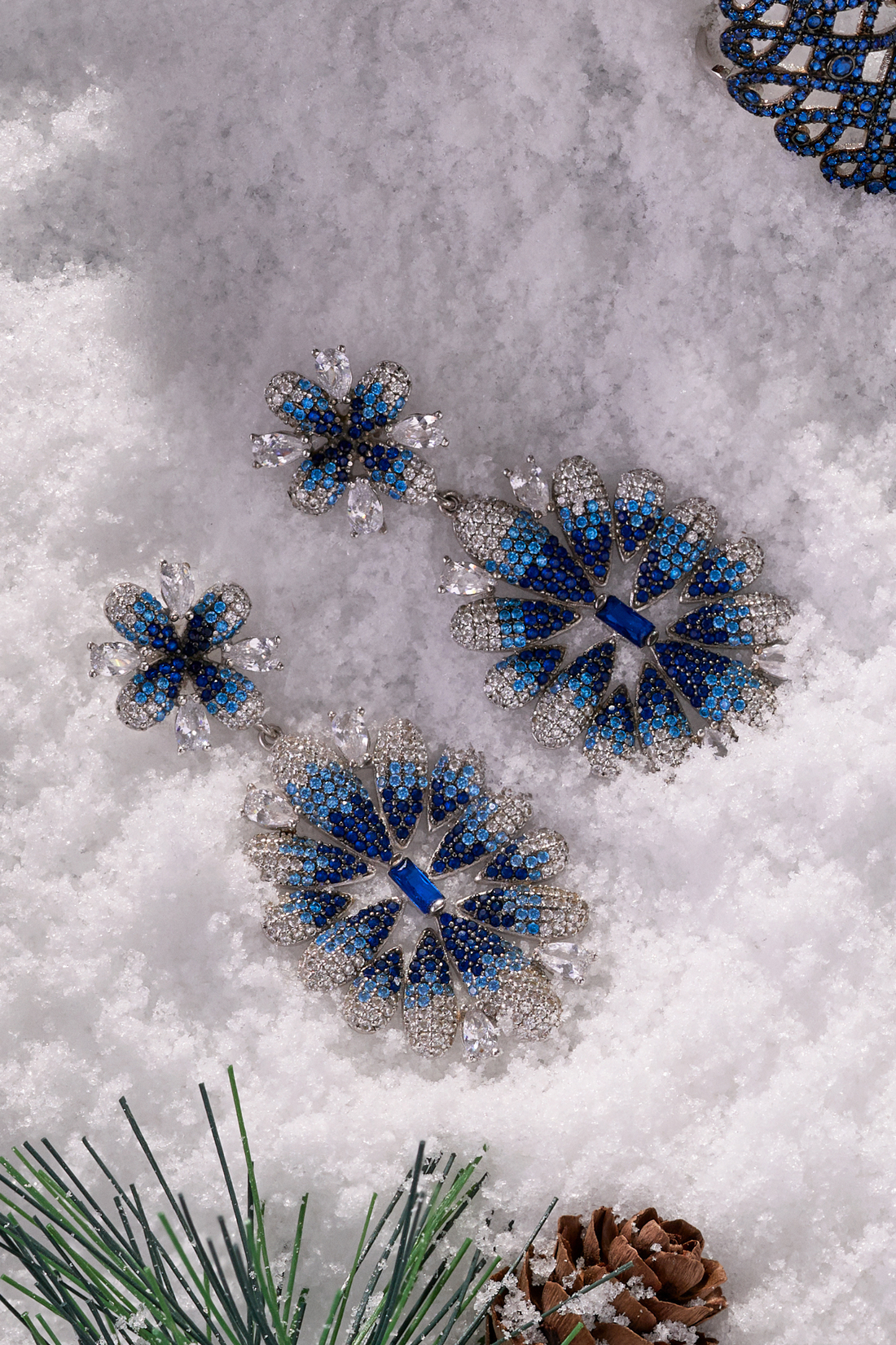 Pair of silver-tone crystal flower drop earrings with ice blue gradient petals