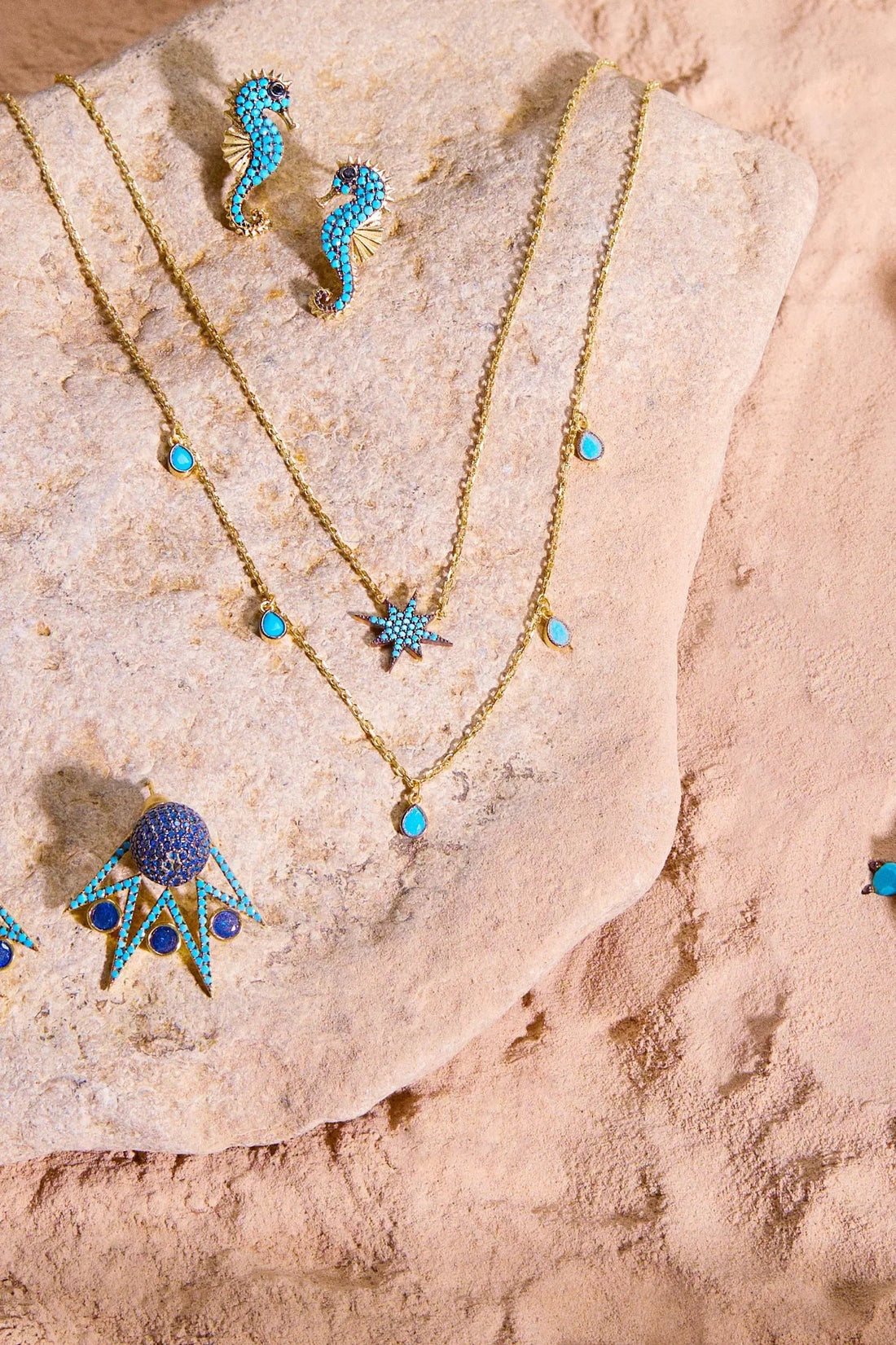 Turquoise seahorse charm jewelry with gold-tone chain and small bead accents