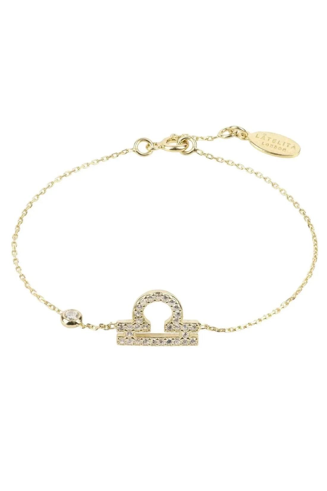 Gold tone bracelet with CZ zodiac pendant and oval engraved clasp tag