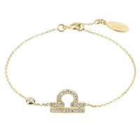Gold tone bracelet with CZ zodiac pendant and oval engraved clasp tag