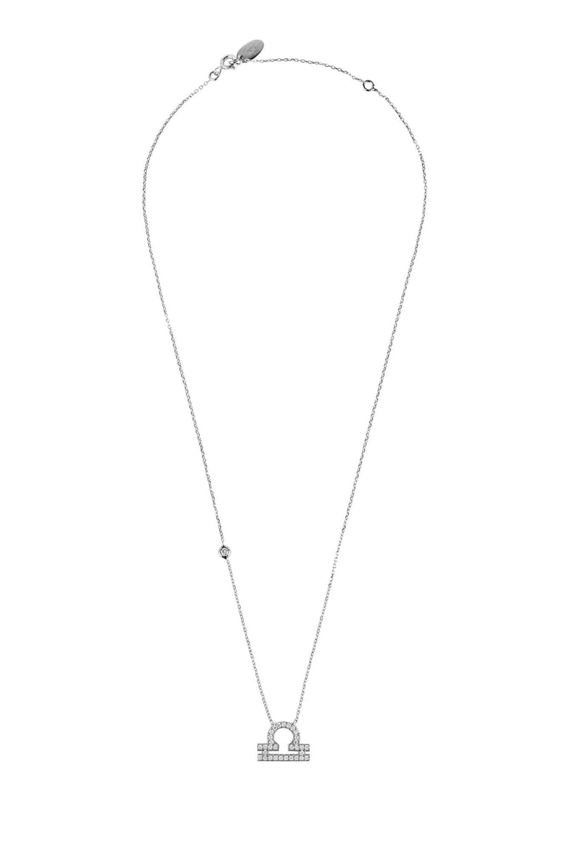Silver zodiac pendant necklace featuring a Libra symbol charm at center