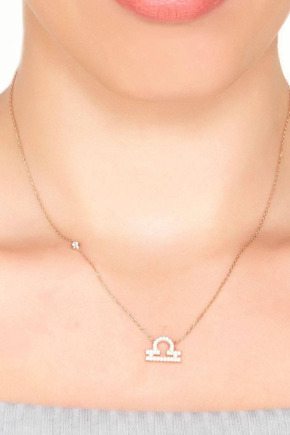 Silver chain necklace with small star charm and Libra pendant with pave border