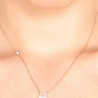 Zodiac Pisces pendant necklace with small starfish-style charm, delicate chain