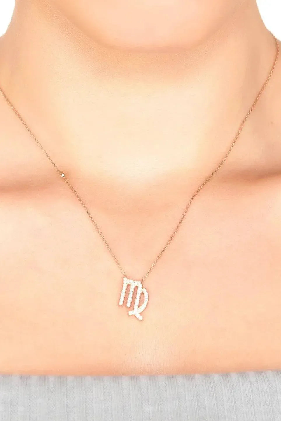 Rose-gold zodiac pendant necklace with crystal Virgo sign on a chain